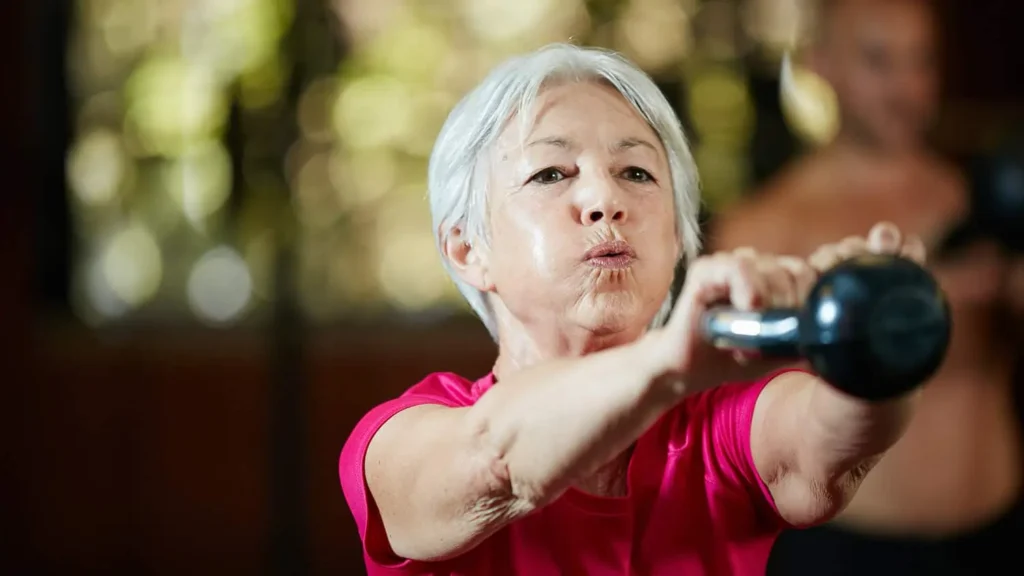 Toning Bingo Wings: Effective Exercises and Tips for Achieving Sleeker Arms 2 Person performing arm exercises with dumbbells Bradford