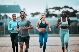 image of people running to incorporate cardio Bradford exercise into their life to help tone arms and body.