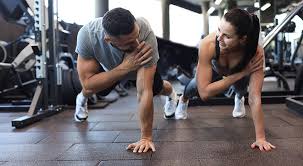 Image of man and woman doing Cardio Bradford to tone their arms. 
